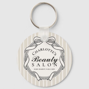 Porte-clés de salon de beauté à cadre orné de crèm