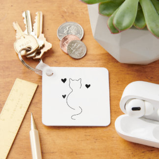 Porte-clés Dessin au trait de chat mignon, avec trois cœurs