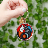 Porte-clés Deux chats dans un design circulaire vibrant (Main)
