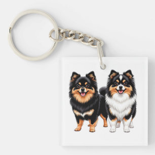 Porte-clés Deux chiens duveteux heureux assis côte à côte