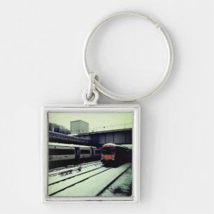 Porte-clés Deux trains, dans la neige