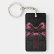 Élégante boîte-cadeau noire avec nœud bordeaux