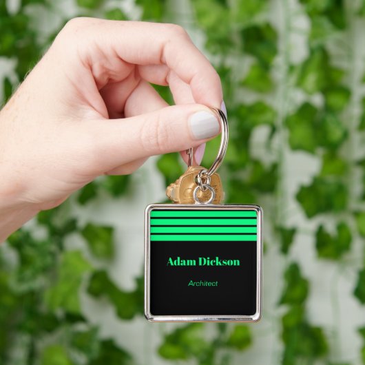 Porte-clés Employé noir rayures vert néon (main)