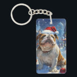 Porte-clés English Bulldog Winter Wonderland Christmas Joie<br><div class="desc">Ce design festif reflète l'esprit joyeux de la période des fêtes, avec un adorable petit portant un chapeau de Père Noël. Le chien est niché dans un pays des merveilles hivernales, avec un bonhomme de neige, un sapin de Noël décoré et des cadeaux joliment emballés. Les flocons de neige tombent...</div>
