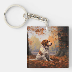 Porte-clés Épagneul breton dans les feuilles d'automne qui to