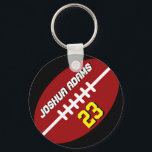 Porte-clés Équipe de sport Porte - clé de football noir rouge<br><div class="desc">Un porte - clé sportif cool et coloré en cadeau pour les familles et les amis. Porte - clé de football américain avec nom personnalisé et numéro de joueur. Un grand souvenir pour l'entraîneur de football,  le capitaine et les joueurs.</div>