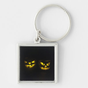 Porte-clés Face citrouille jaune Eerie sur noir