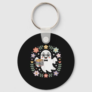Porte-clés Fantôme tenant des livres entouré de fleurs d'auto