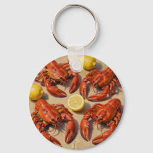 Porte-clés Fête de homard bouilli frais au citron sur journal