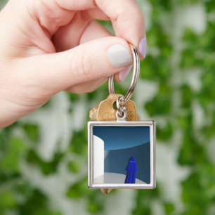 Porte-clés Figure dans le manteau bleu