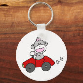 Porte-clés Fille de singe dans la voiture rouge (Recto)