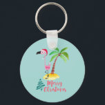 Porte-clés Flamant rose Rose Dans Un Chapeau De Père Noël Par<br><div class="desc">Porte - clé avec une jolie illustration d'un flamant rose dans un chapeau de santa rouge. À côté d'un palmier vert sur un monticule de sable jaune. Un design d'arbre de Noël tourbillonnant est placé à côté du texte Joyeux Noël. Écrit dans la couleur rose dans une police manuscrite fantaisie....</div>