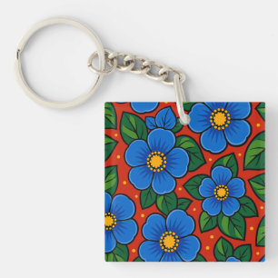 Porte-clés Fleurs bleues et feuilles vertes sur fond rouge