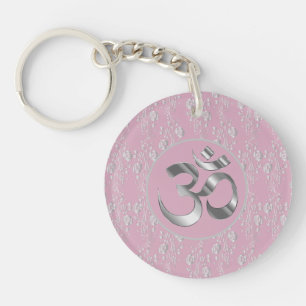 Porte-clés Fleurs d'argent sur le symbole OM rose