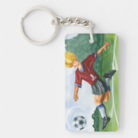 Footballeur donnant un coup de pied une boule par