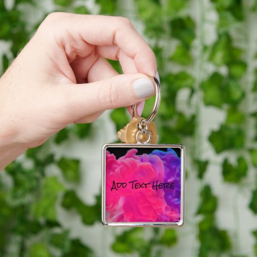 Porte-clés Fumée numérique rose et violet (main)