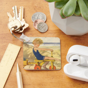 Porte-clés Garçon vintage Jouer à la plage avec des jouets de