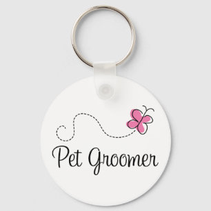 Porte-clés Groomer rose mignon d'animal familier de papillon