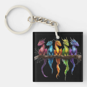 Porte-clés Groupe Arc-en-ciel de bébés dragons sur fond noir