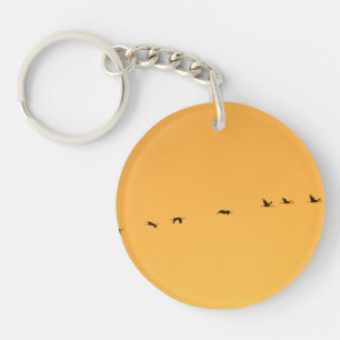 Porte-clés Grues au lever du soleil