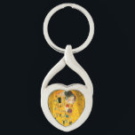 Porte-clés Gustav Klimt Le Baiser<br><div class="desc">Porte - clé avec la peinture à l’huile de Gustav Klimt avec la feuille d’or The Kiss (1908). Un homme et une femme, aux couleurs dorées brillantes, embrassent et embrassent avec amour dans un champ de fleurs. Un grand cadeau pour les amateurs d'art Art Nouveau et autrichien.</div>