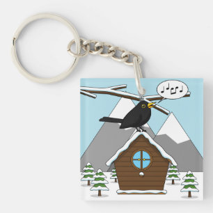 Porte-clés Happy Blackbird chanter dans le paysage hivernal