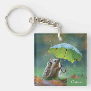Porte-clés Hérisson mignon tenant un parapluie de feuilles