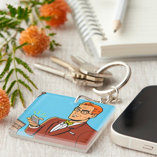 Porte-clés Homme de style BD regardant un téléphone mobile