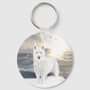Porte-clés Husky blanc aux yeux bleus, dans la neige