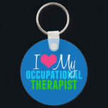 Porte-clés J'adore mon OT<br><div class="desc">J'aime mon ergothérapeute. Un cadeau OT mignon en jolies couleurs primaires pour votre thérapeute sensorielle préféré.</div>