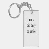 Porte-clés je suis un peu occupé à sourire (Devant gauche)