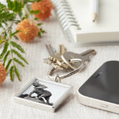 Porte-clés Jeune éléphant attrapé dans un piège (Côté)