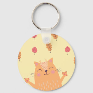 Porte-clés Joli chat orange roux jouant dans les feuilles d'a