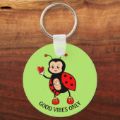 Porte-clés Jolie coccinelle et cœur sur fond vert (Recto)