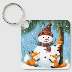 Porte-clés Jolis renards et bonhomme de neige en forêt hivern