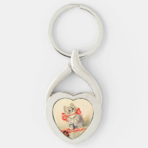 Porte-clés Kitten avec ruban rouge