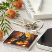 Porte-clés Kitten noir en Casquette sorcier au milieu des Cit (Devant Droit)