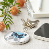 Porte-clés La magie des papillons bleus. (Côté)