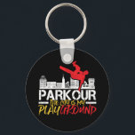 Porte-clés La ville est mon terrain de jeu Parkour et Freerun<br><div class="desc">La ville est mon aire de jeu. Design amusant et humoristique pour les amateurs de parkour et de freerunning. Marchandises de design vintage et en détresse pour les personnes extérieures. Parfait pour les amateurs d'activités de plein air et de sports extrêmes. Grand cadeau de Noël et cadeau d'anniversaire pour père,...</div>