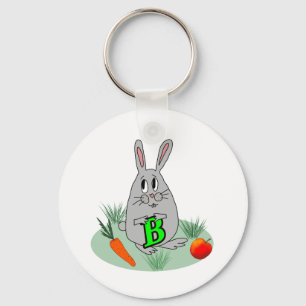 Porte-clés Lapin avec la lettre B sur la pelouse