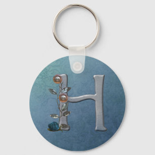 Porte-clés Le métal fleurit le monogramme H