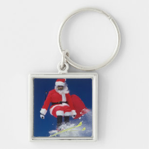Porte-clés Le père noël sur sauter de skis outre d'une