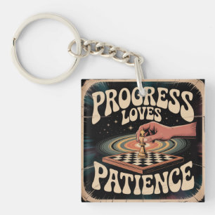 Porte-clés Le progrès aime la patience