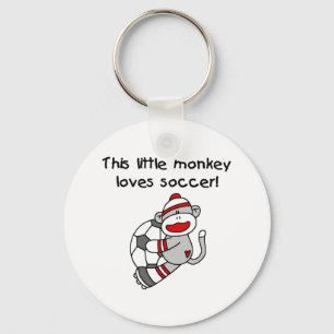 Porte-clés Le singe de chaussette aime le football