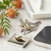 Porte-clés Le tapis magique, 1880 (Côté)