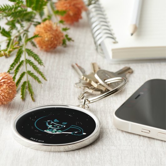 Porte-clés Le trou noir dévore (Côté)