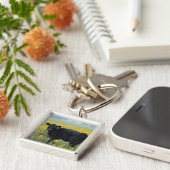 Porte-clés Le veau noir dans un champ de tournesols (Côté)