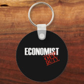 PORTE-CLÉS L'ÉCONOMISTE SOMBRE (Recto)