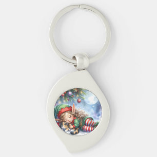 Porte-clés L'elfe de Noël endormi avec un chaton calicot
