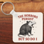 Porte-clés Les Horreurs Persistent Mais Moi Aussi (Recto)